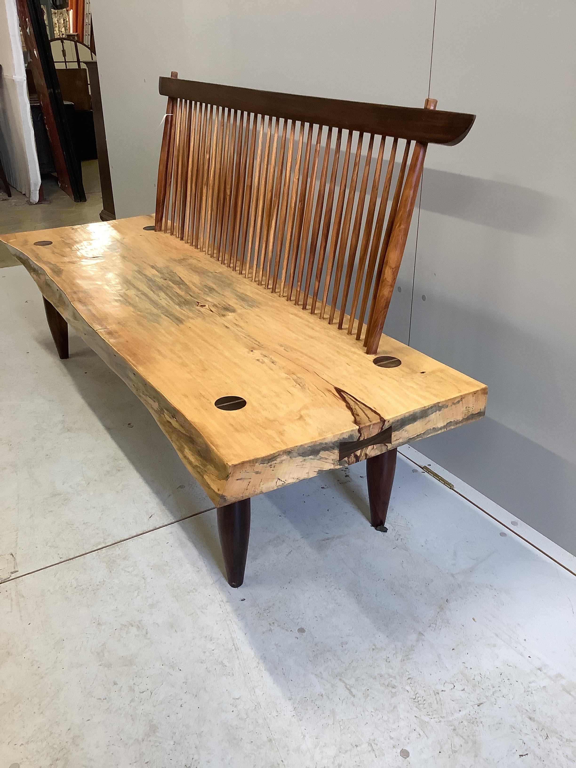 In the manner of Mira Nakashima a Conoid comb back bench width 180cm, depth 60cm, height 95cm